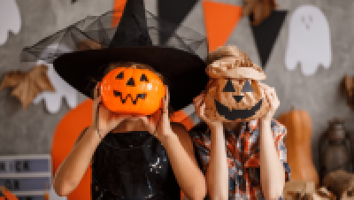 kids with pumpkin on face